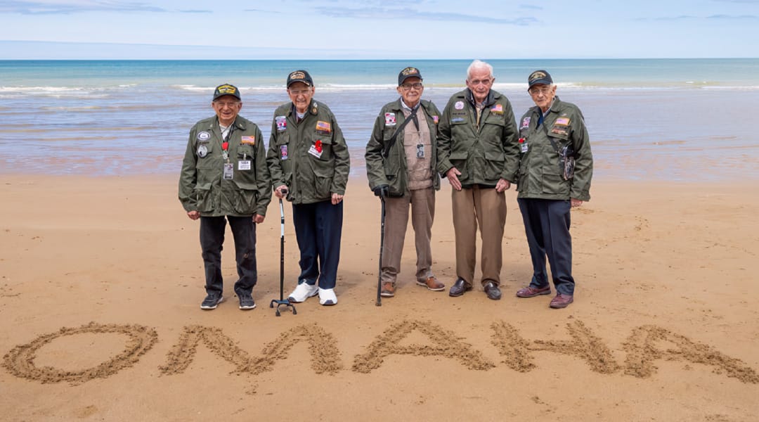 Home-D-Day-Vets-on-Beach-Omaha-in-Sand Veterans return to the Normandy beach 80 years after landing on D-Day